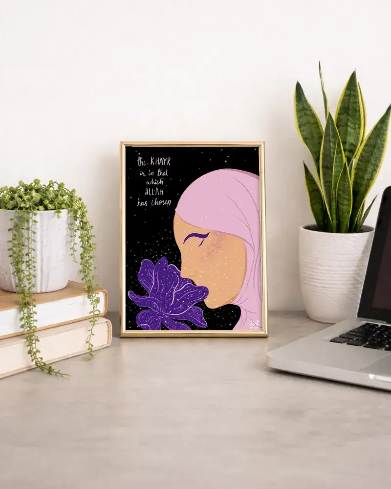 Framed Islamic art print on a desk